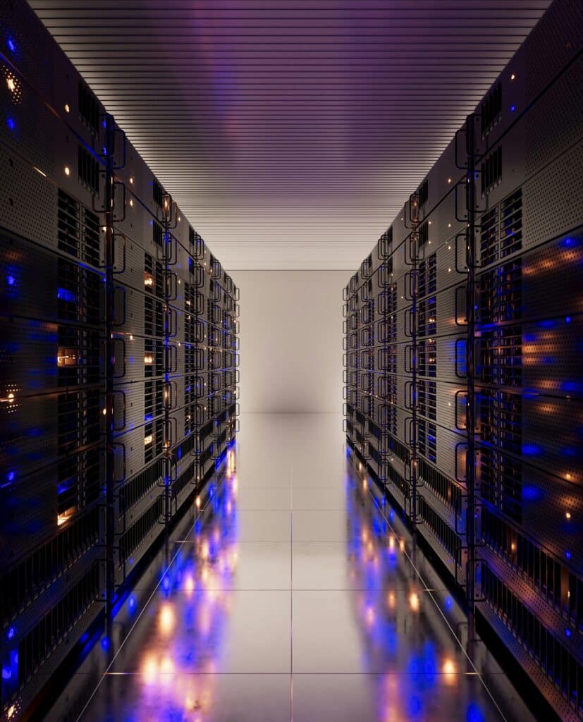 A sleek data center hallway with rows of black server racks on both sides, glowing blue and orange lights, and a reflective tiled floor, conveys a futuristic and high-tech atmosphere.